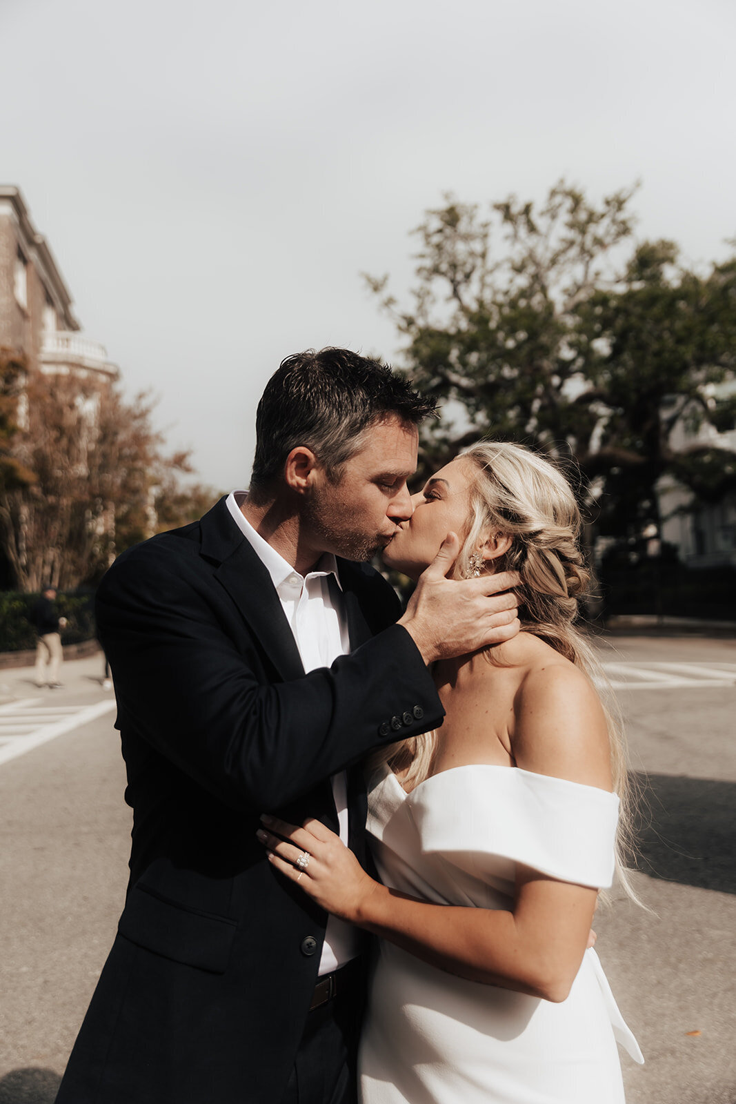 Couple sharing a kiss after eloping in Charleston