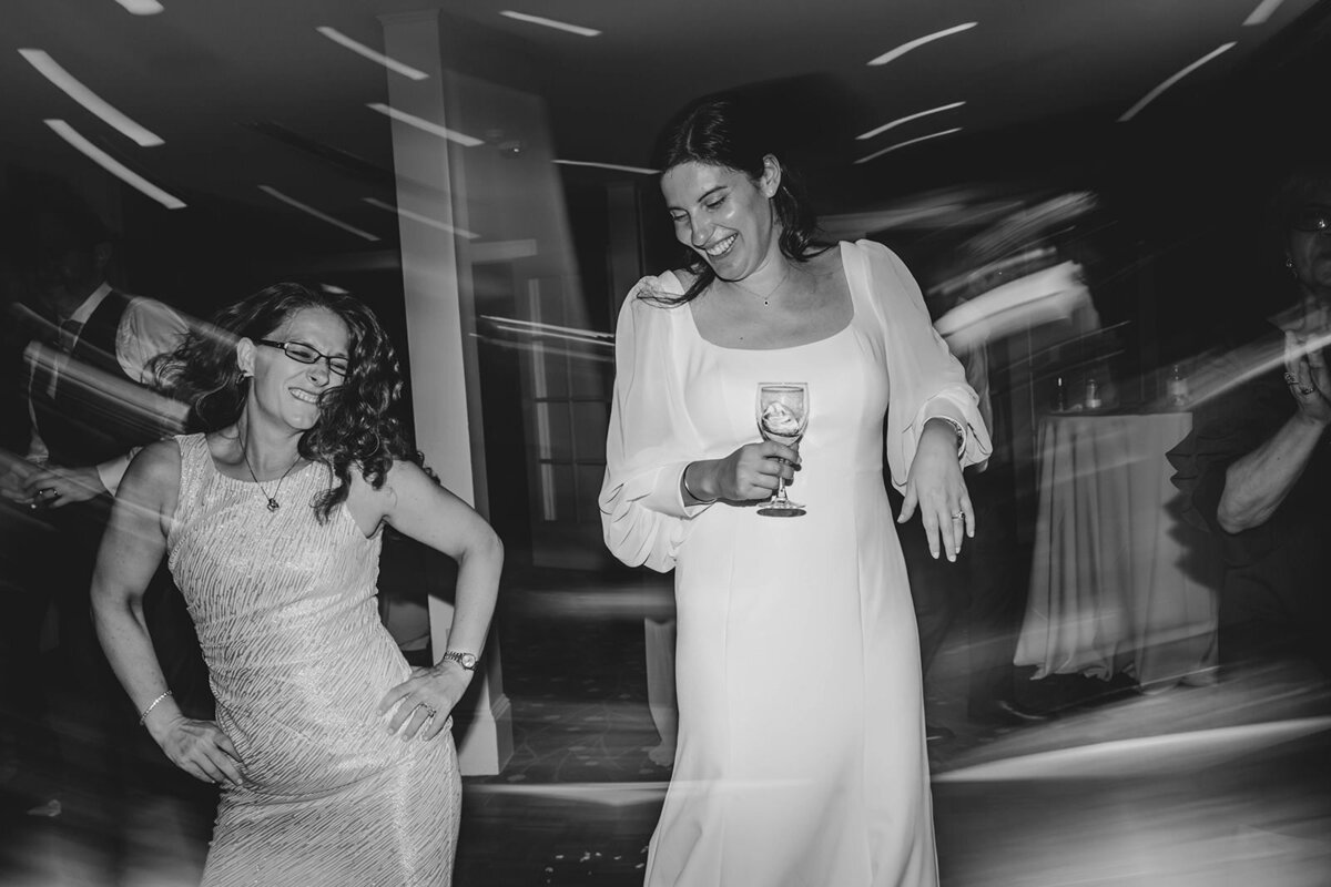A newlywed dancing with a wedding guest