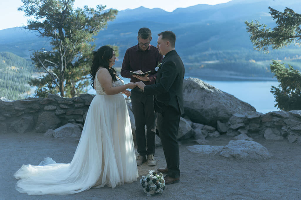 A couple exchanging rings at their wedding.