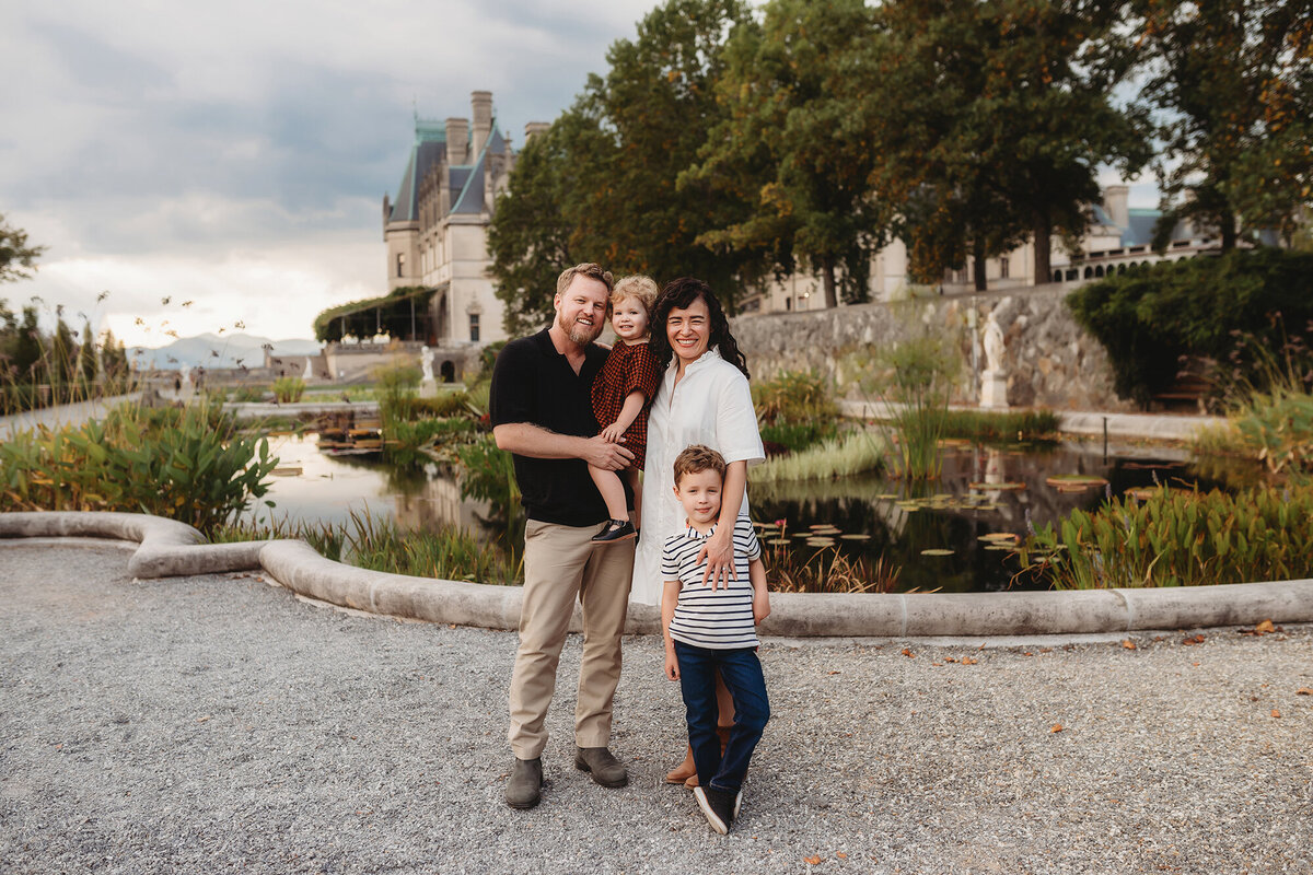 Family poses for Family Photos at Biltmore Estate in Asheville, NC.