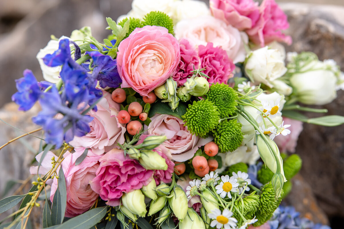 spring wedding bouquet with pink  ranunculas at wedding in San Antonio Texas by Firefly Photography
