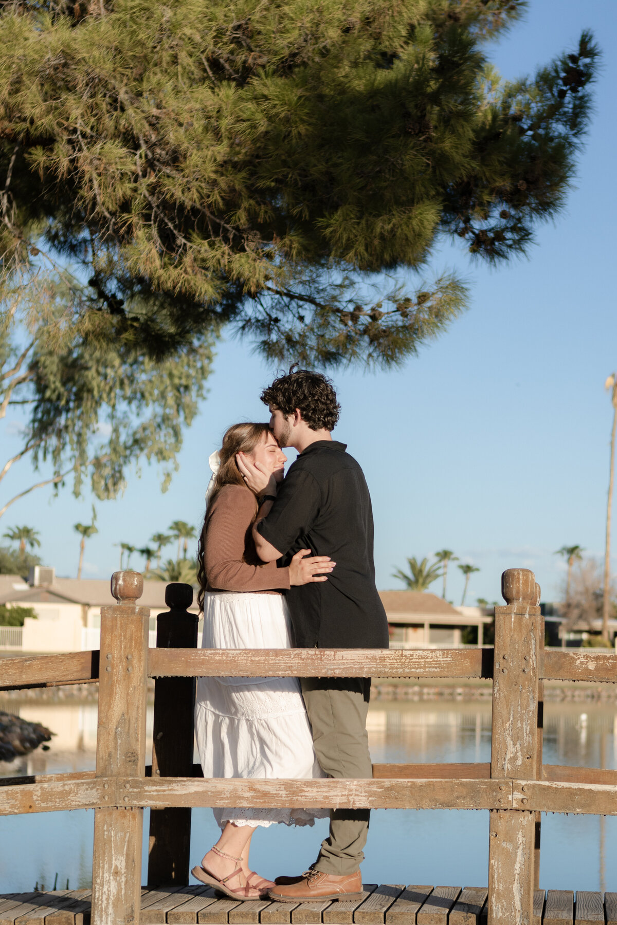 Jovanna G Photography. Classic, sophisticated Wedding Photos. Soft romantic engagement photos. Soft romantic WeddingPhotos. Sophisticated Wedding Photographer. Professional Wedding Photographer. Destination Wedding Photographer. Luxury Wedding photographer. Traveling Wedding Photographer. AZ Wedding Photographer. Gilbert AZ Wedding Photographer. Queen Creek Wedding Photographer. Phoenix Wedding Photographer. Scottsdale Wedding Photographer. Flagstaff Wedding Photographer. SoCal Wedding Photographer. California Wedding Photographer. Northern California Wedding Photographer. Southern California Wedding Photographer. San Francisco Wedding Photographer. Bay Area Wedding Photographer. San Jose Wedding Photographer. Golden Gate Bridge Wedding Photographer. Beach Lover Wedding Photographer. Palace of the Fine Arts Wedding Photographer. Ocean Lover. I love California. Orange County Wedding Photographer. Newport Beach Couples Photographer. Newport Beach Wedding Photographer. Laguna Beach Couples Beach Engagement Photographer. Laguna Beach wedding beach photographer. Los Angeles Wedding Photographer. Young and in love engaged couples who live in southern California. Christian Young Couple. Young Engaged Couple. Engaged High School Christian Couple. Christian Values. Young conservative Christian women. Young Conservative Christian men. Young Conservative Christian Couple. Young Christian Couple Engaged in High School. Young Christian College Couple. Lakeside Lovers in the Autumn Sun. David & Grace - engagement photos. Jovanna G Photographer Engagement Photos. Arizona sun shining through autumn trees- engagement. Chandler, AZ Engagement Photos. Chandler, AZ 2026 bride. Chandler, AZ Wedding Photographer. Chandler, AZ Young Engaged Couple. Girl in her 20s. Engaged Arizona Girl in her 20s. Lakeside Engagement photos. AZ Lakeside Engagement Photos. AZ Weeping Willow Lakeside Proposal. Arizona Lakeside Proposal with weeping willow tree. Detail shot of engagement ring on Arizona Lakeside estate. Chandler, AZ Lakeside Estate Proposal Outfit Inspiration.