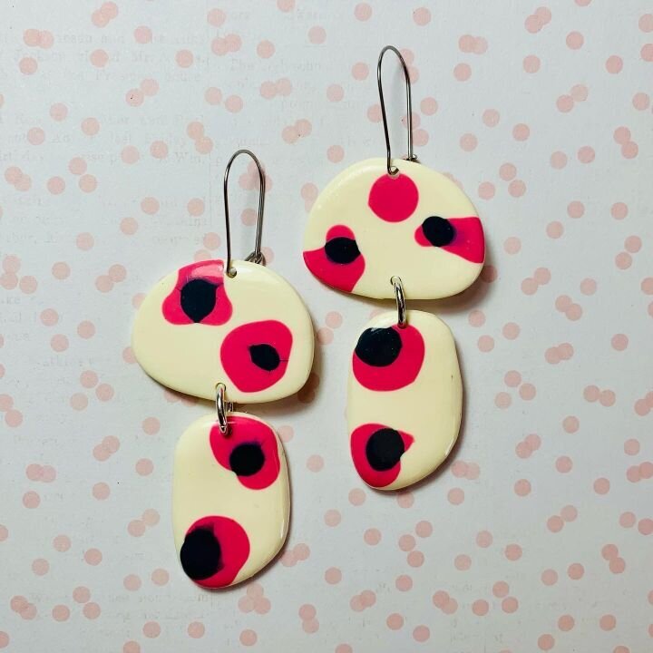 Handmade earrings with red and black spots