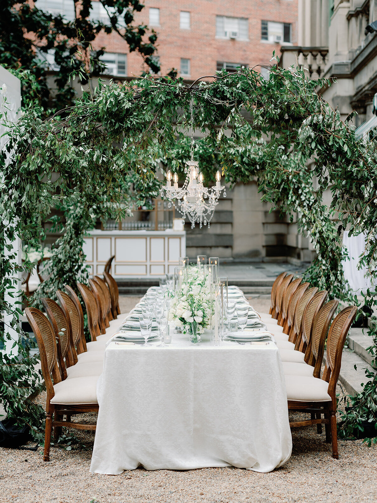 Classic wedding at Anderson House with green floral arch
