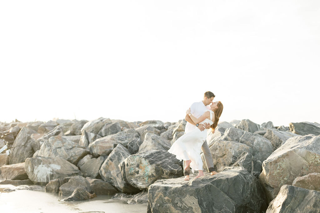 sunset beach engagement session on large rocks