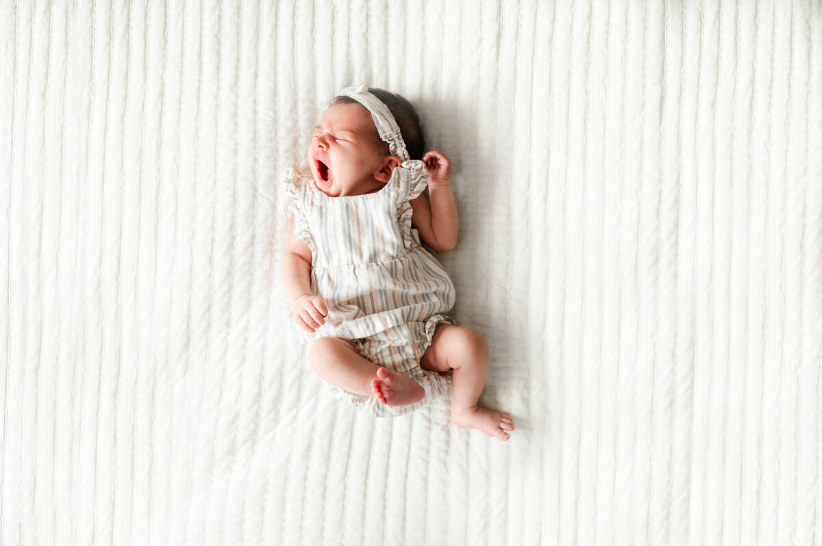 newborn girl yawning