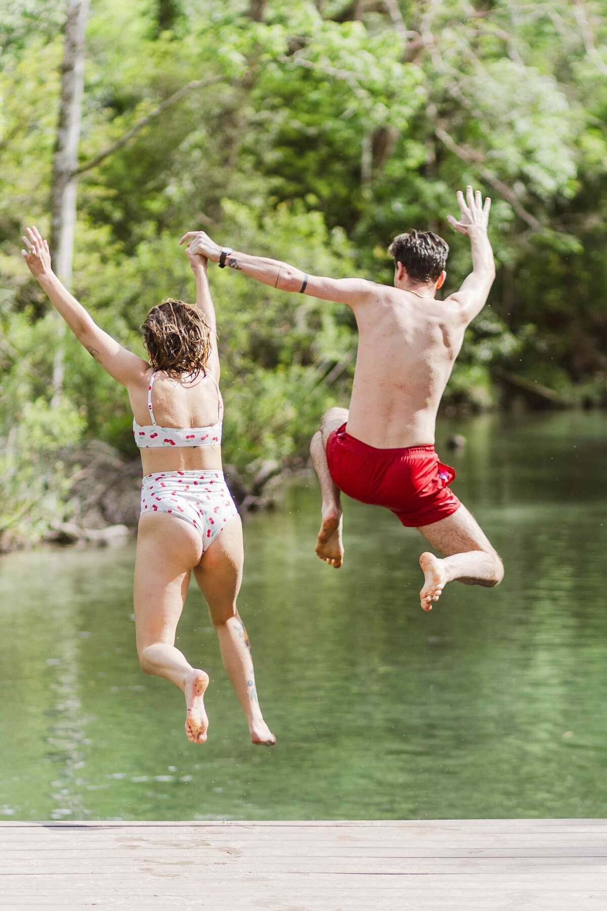 18-couple-jumping-off-dock