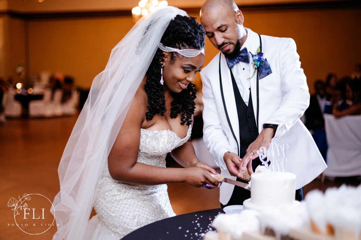 cincinnati wedding photographer videographer cake cutting reception photos kolping event center 