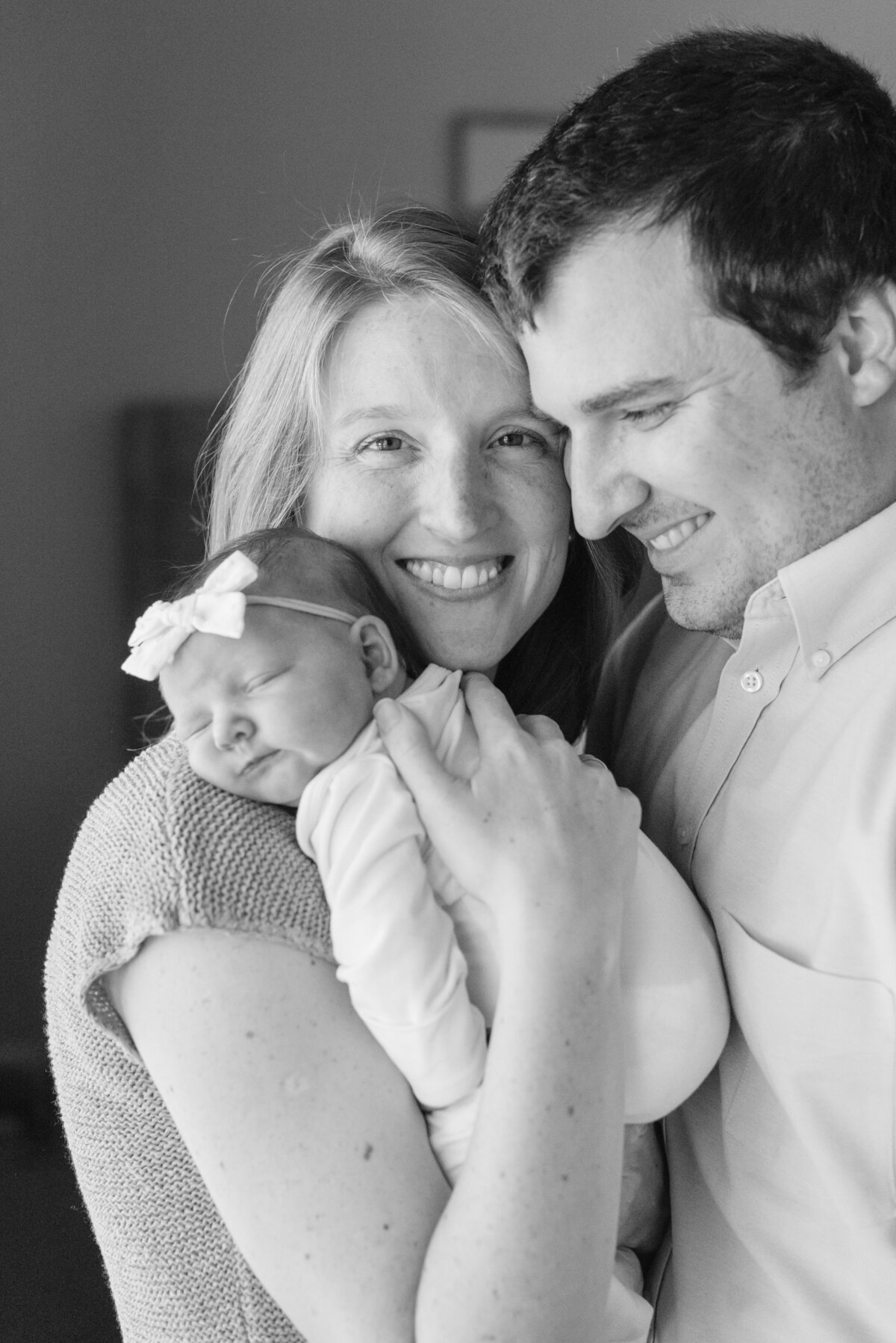 Black and white photo of parents holding newborn baby - Washington DC Newborn Photographer