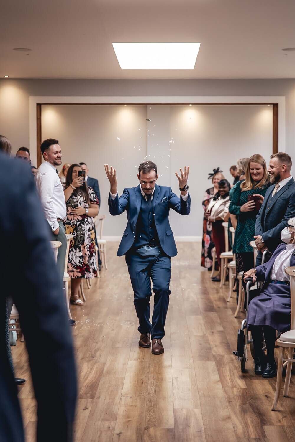 Groom dances at wedding