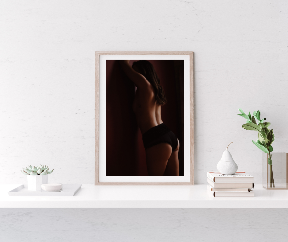Framed wall art of a boudoir image featuring a woman's back in Minneapolis MN