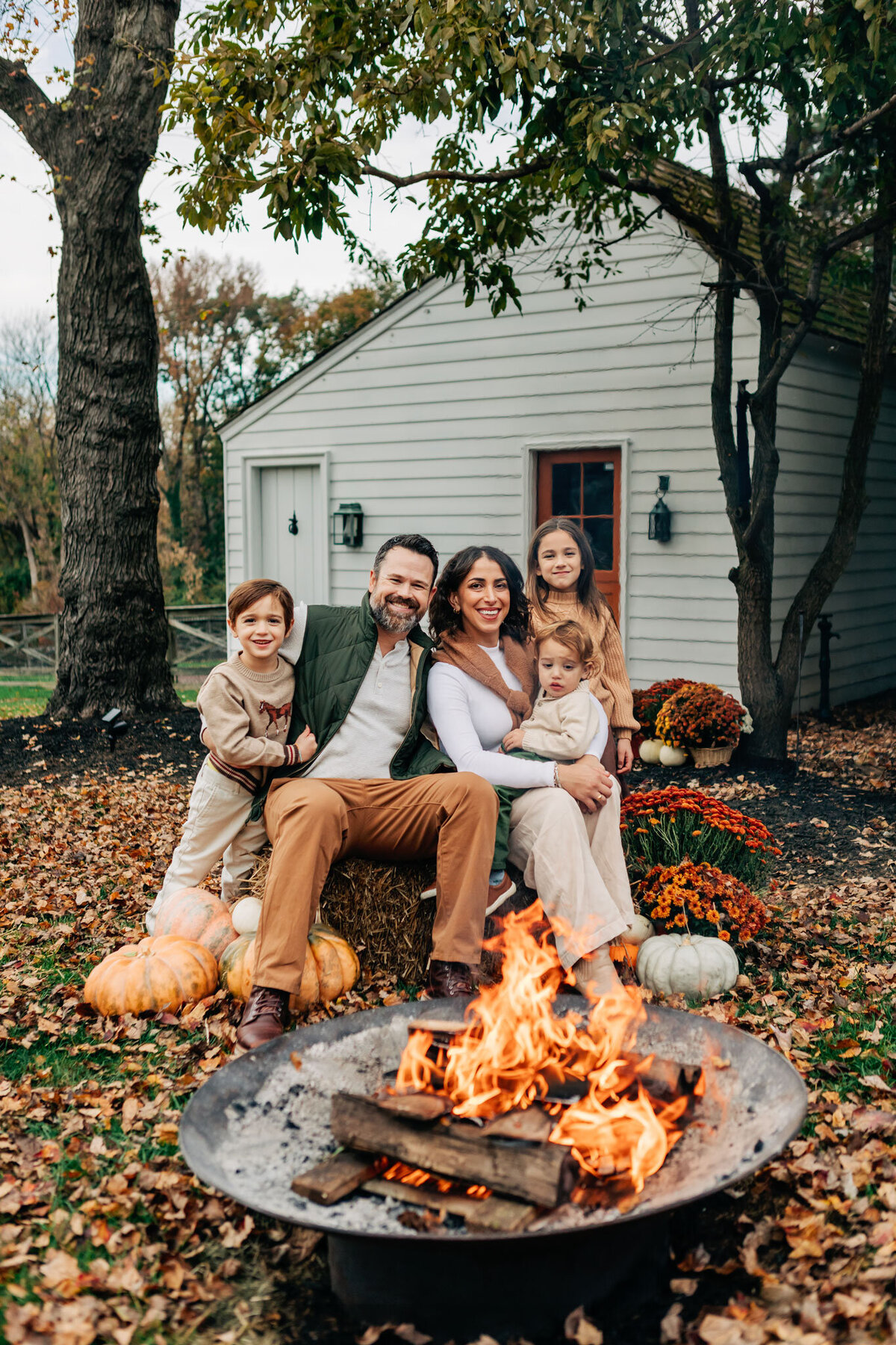 family-by-firepit-in-fall
