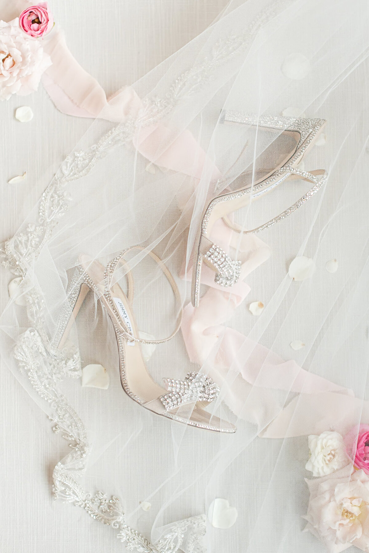 rhinestone bridal shoes under embellished veil