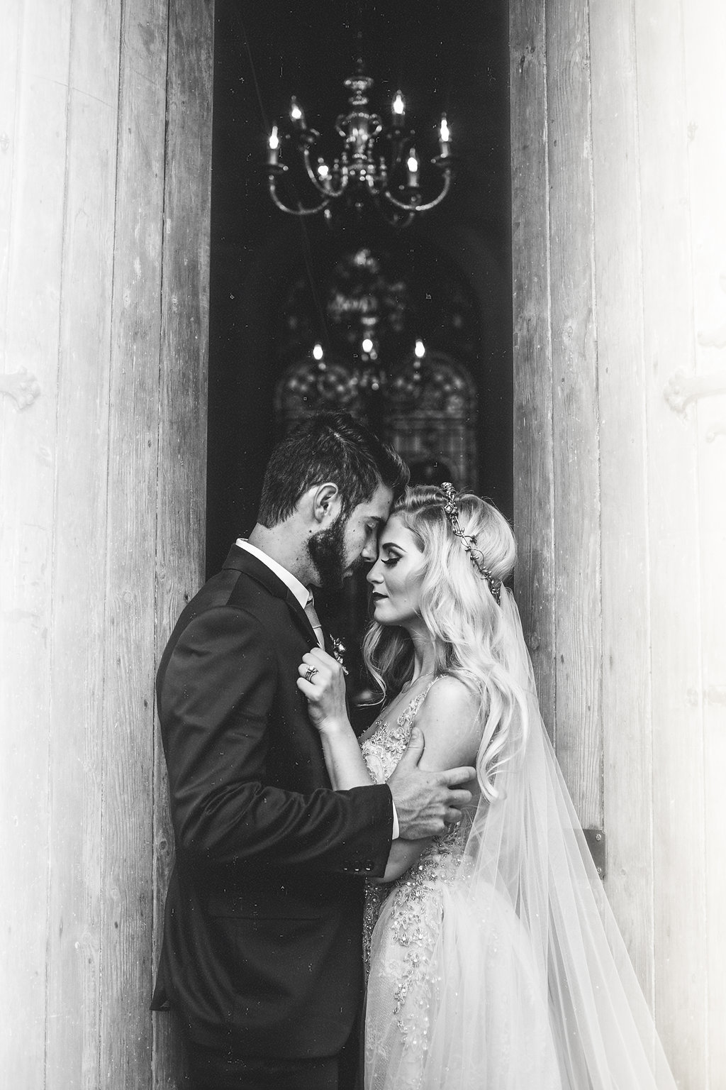 Wedding Photograph Of Bride and Groom Kissing at the Door of Church Black and White Los Angeles