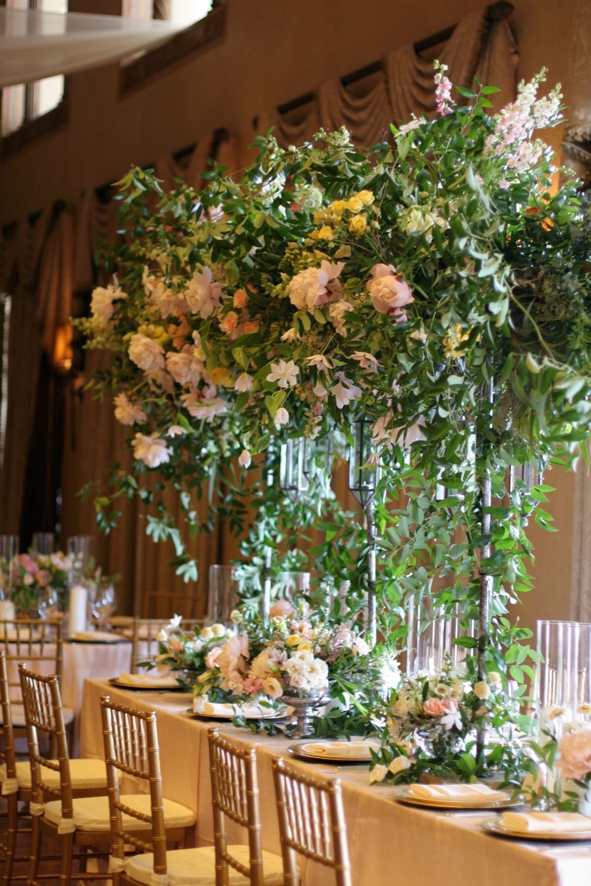 Flower arch over head table at summer wedding | White Magnolia Designs