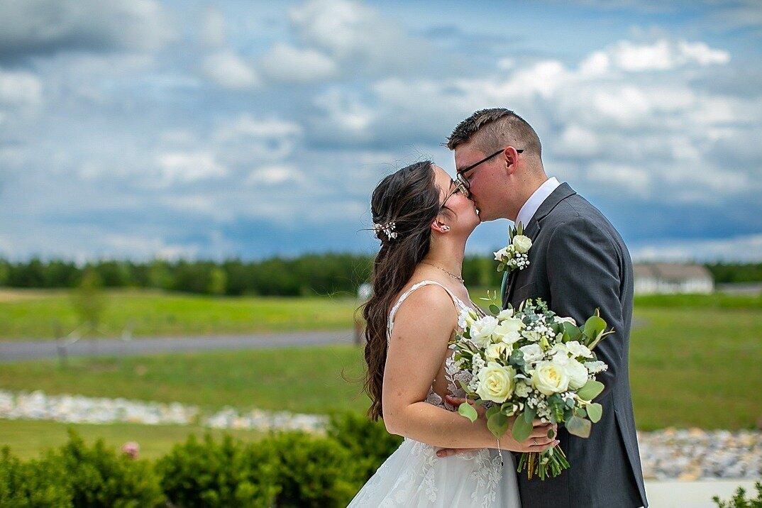 Bride-Groom-Kissing-Outside-The-Legacy-at-Willow-Pond.JPG