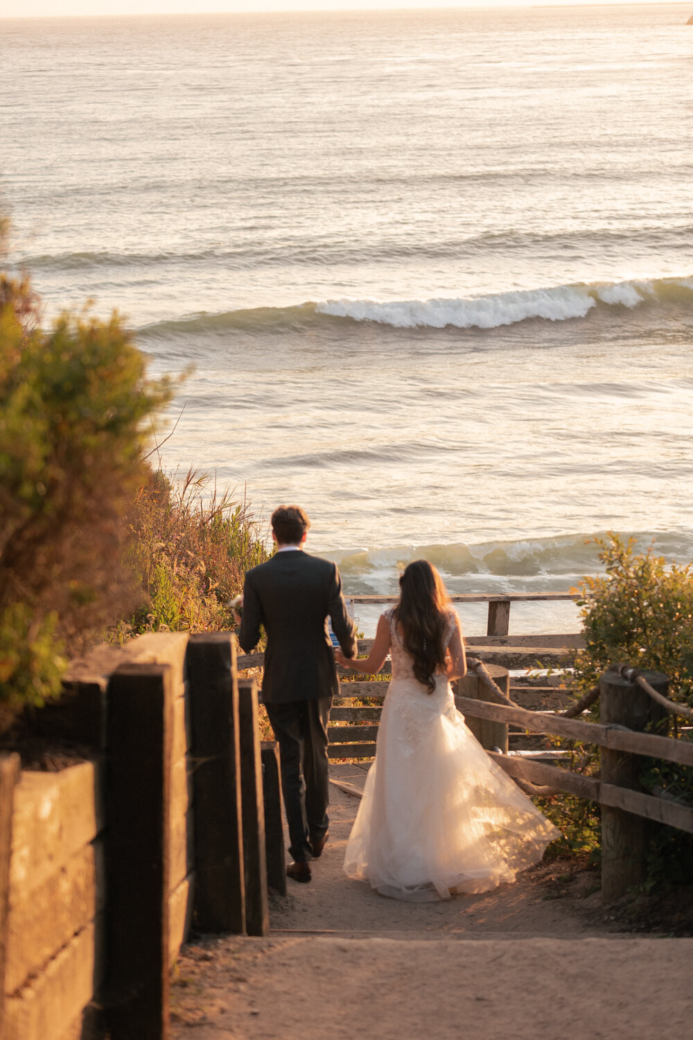 candid Wedding Photos of couple holding hands in Pismo Beach