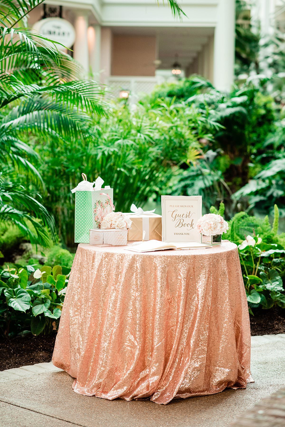 Rose gold sequin tablecloth on gift table