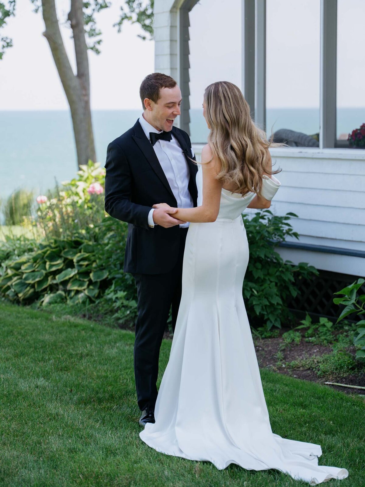 Bride and groom by Lake Erie in Cleveland before their wedding ceremony