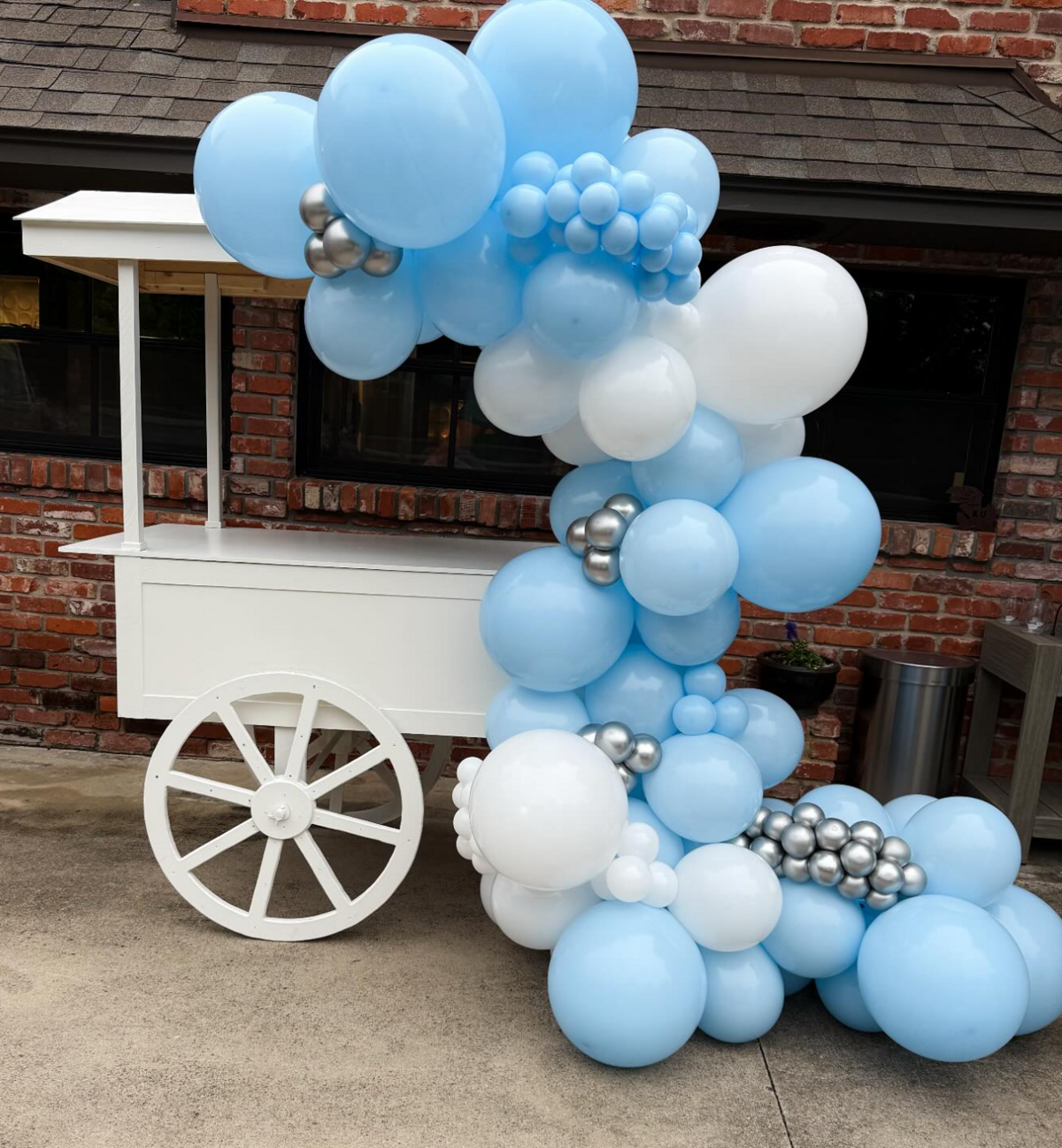 champagne cart with light blue balloons