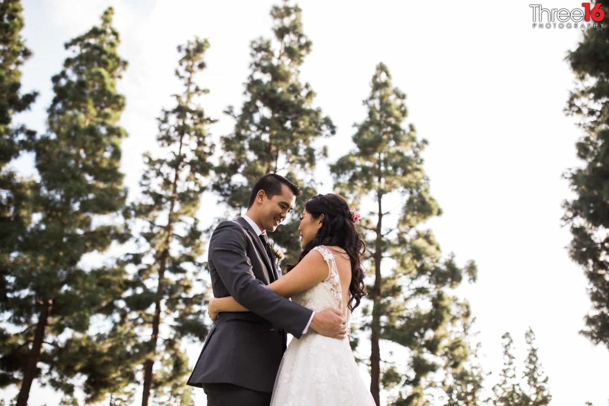 Bride and Groom embrace during the first look