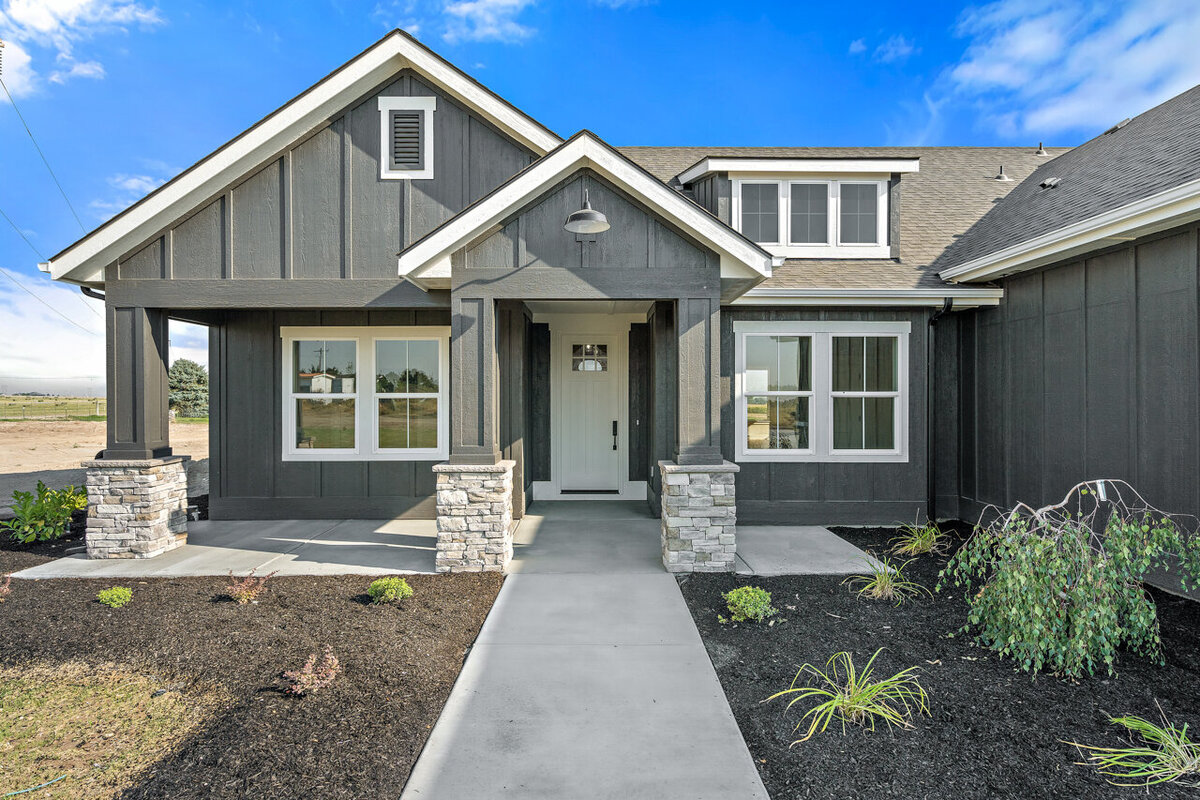 new home in subdivision gray with white door