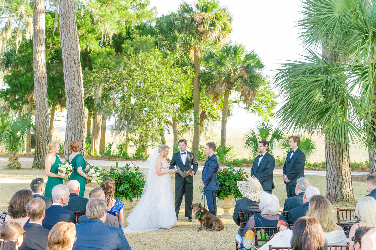 Wedding ceremony vows at Palmetto Bluff near Charleston, South Carolina. Photographed by destination and Charleston wedding photographer Dana Cubbage.