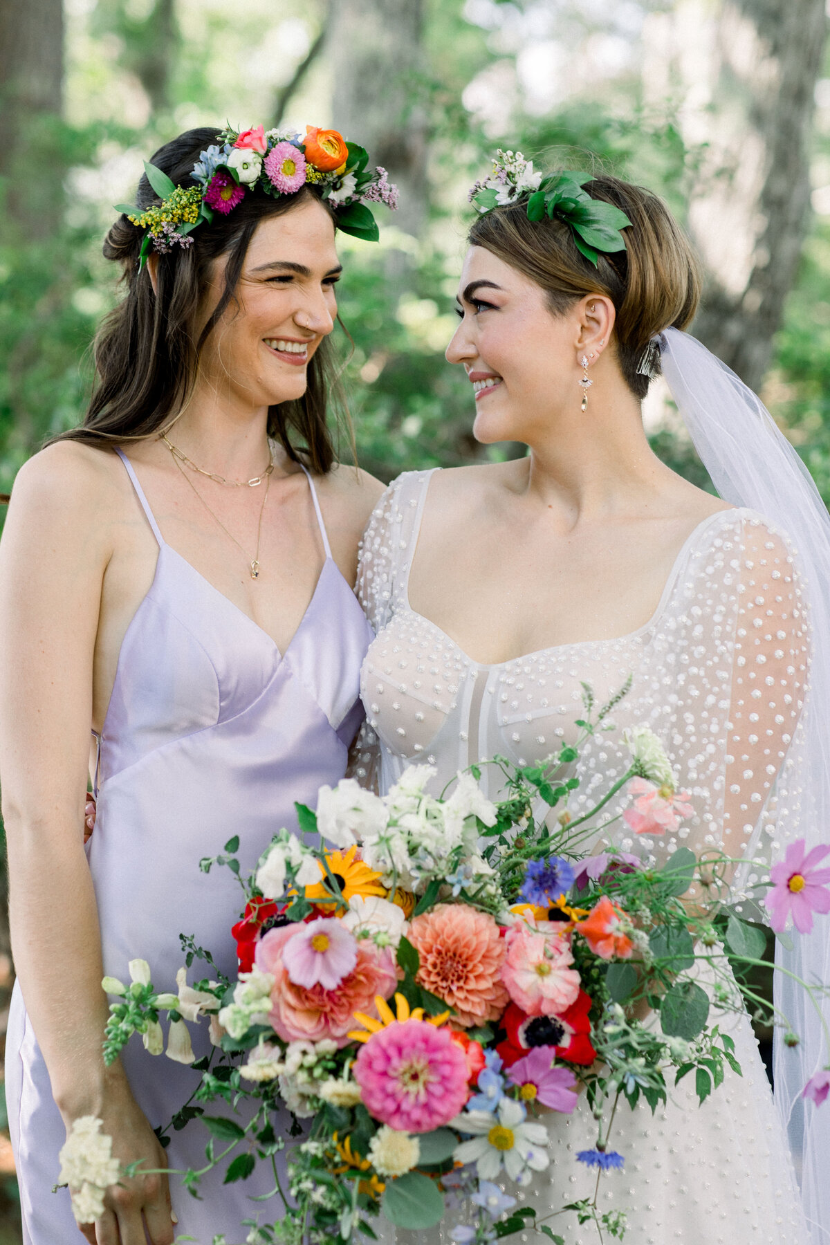 Bride with bridesmaids with colorful bouquets at New Hampshire wedding