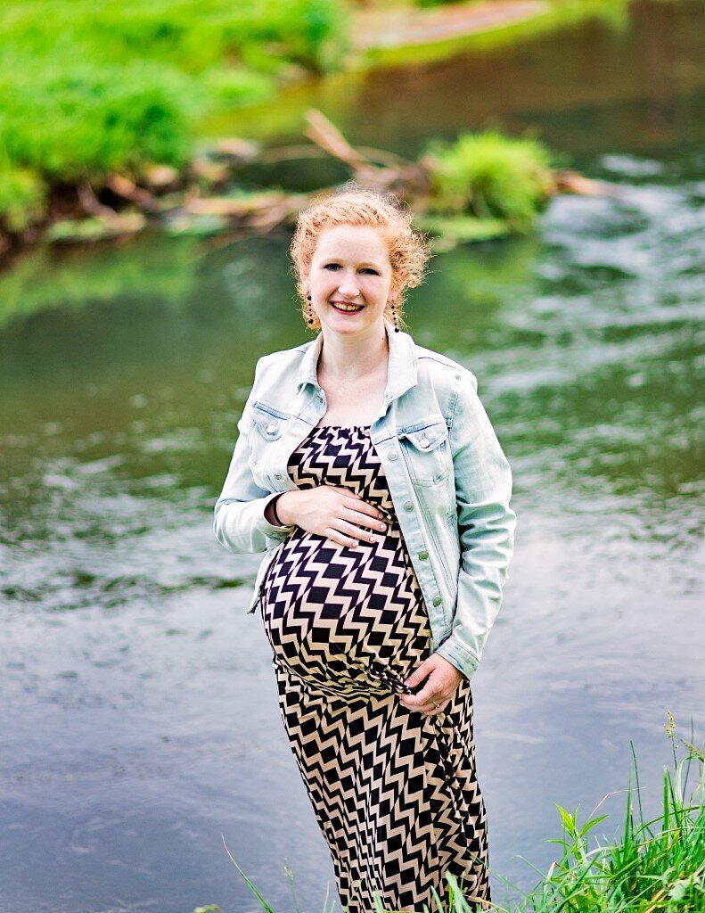 expecting woman by river