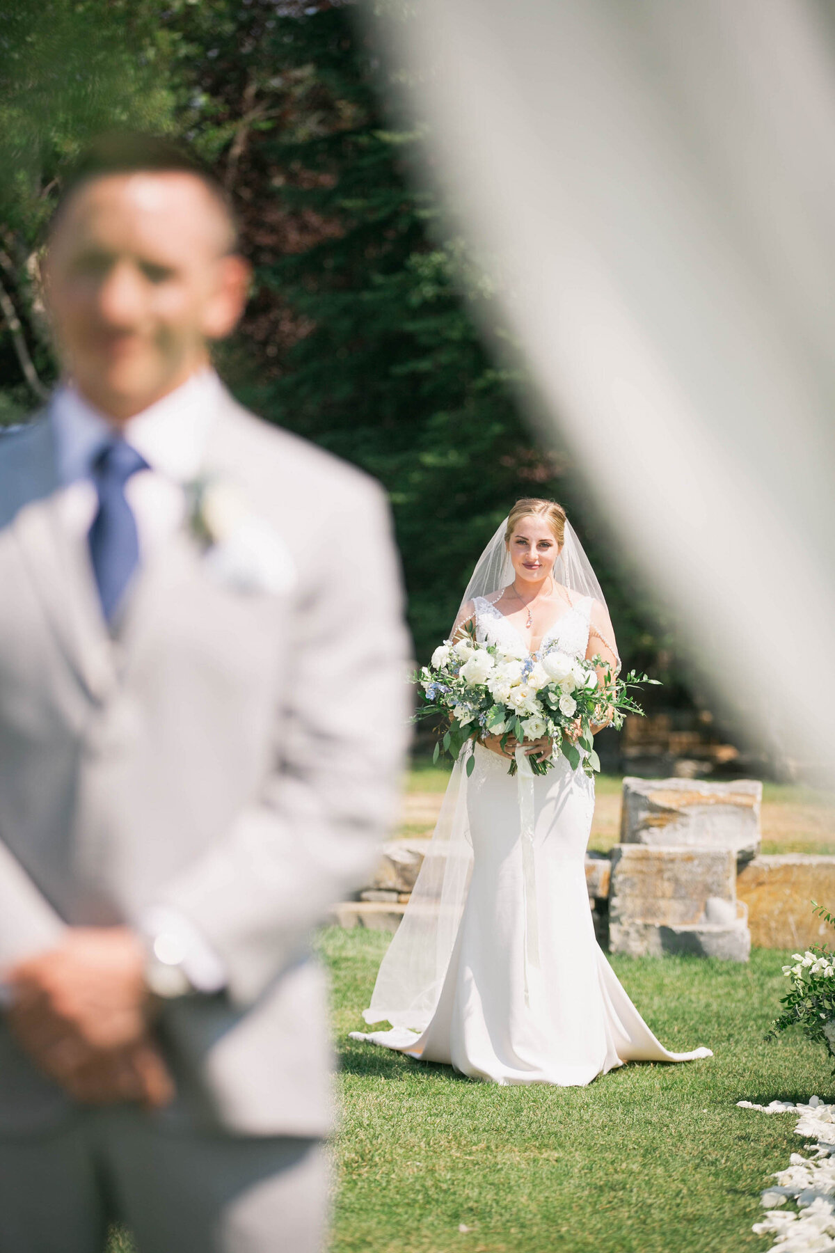 view of bride coming up to groom from behind