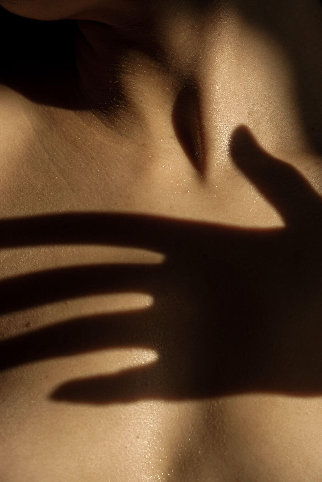 Close-Up of Woman’s Face with Shadows in Black and White

