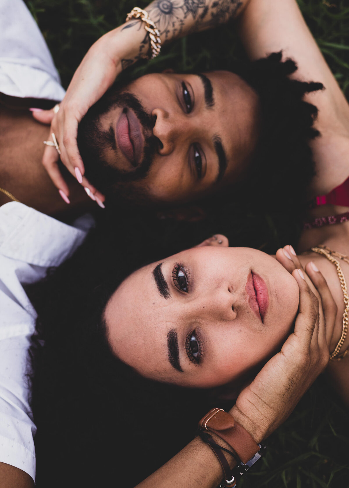 Couple holding each other's faces, stylish and loving