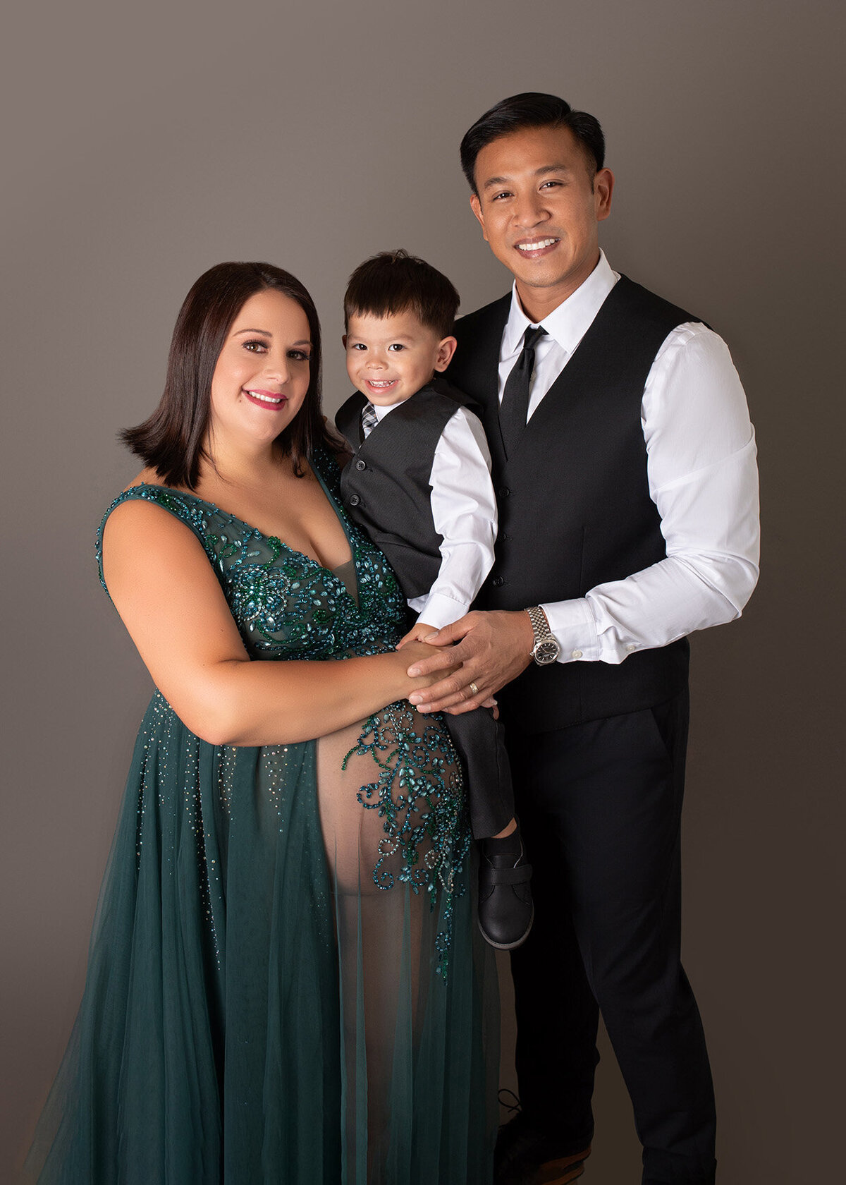 Portait of a well dressed family expecting their second child in Houston Texas, captured by Laura King Photography