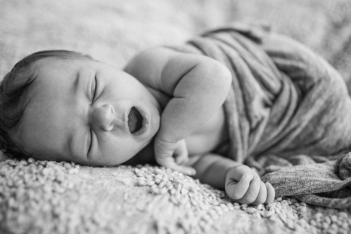 Newborn girl yawning