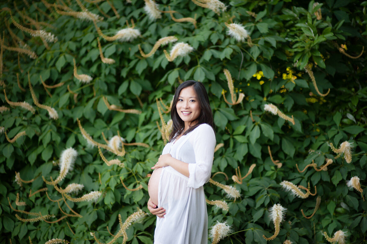 Maternity session surrounded by trees