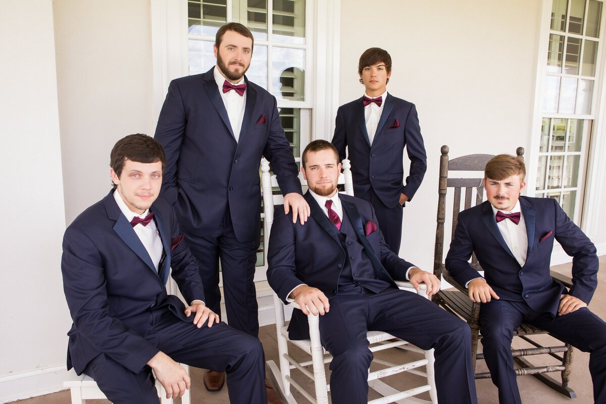 groomsmen posing in chair