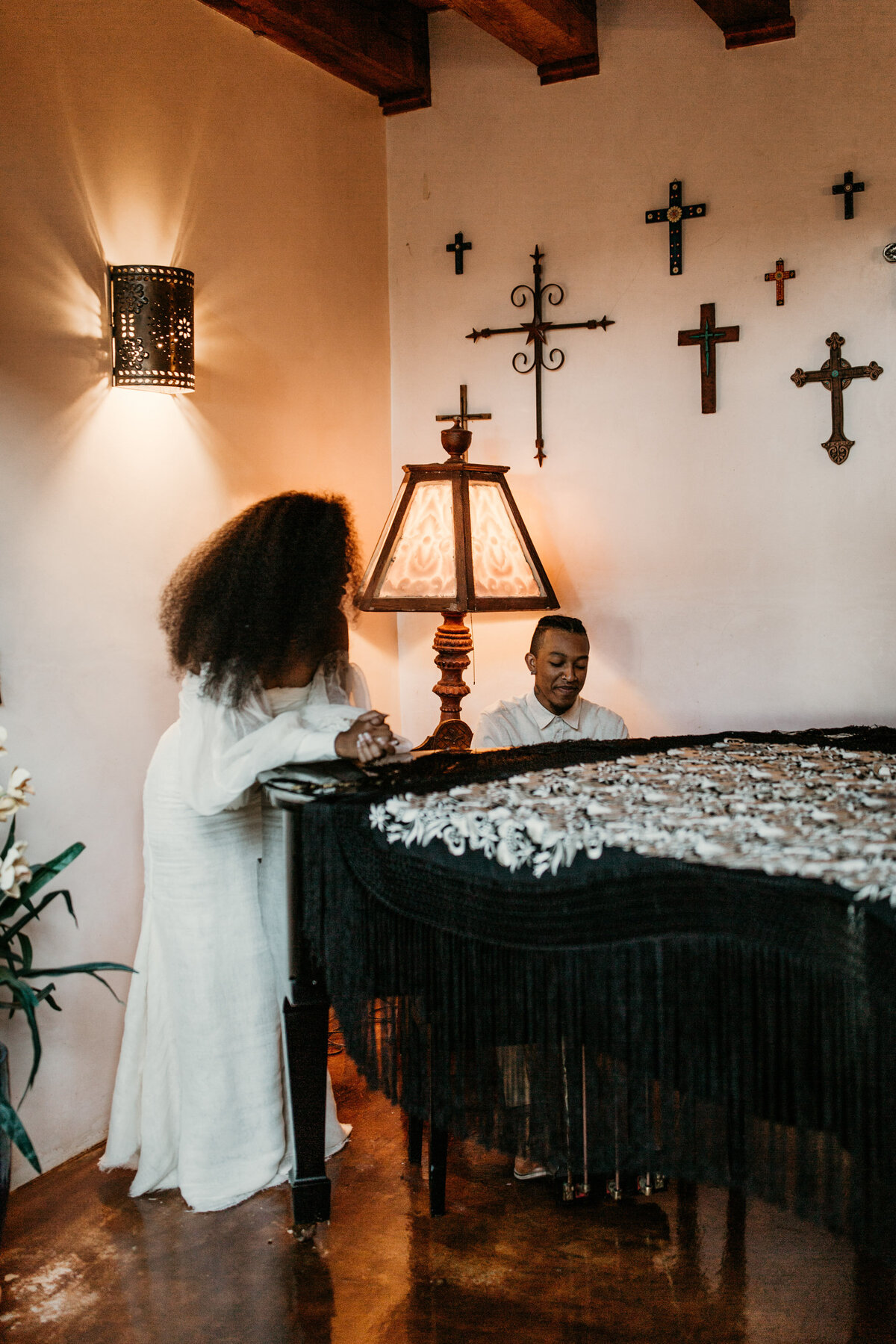 groom playing piano for bride