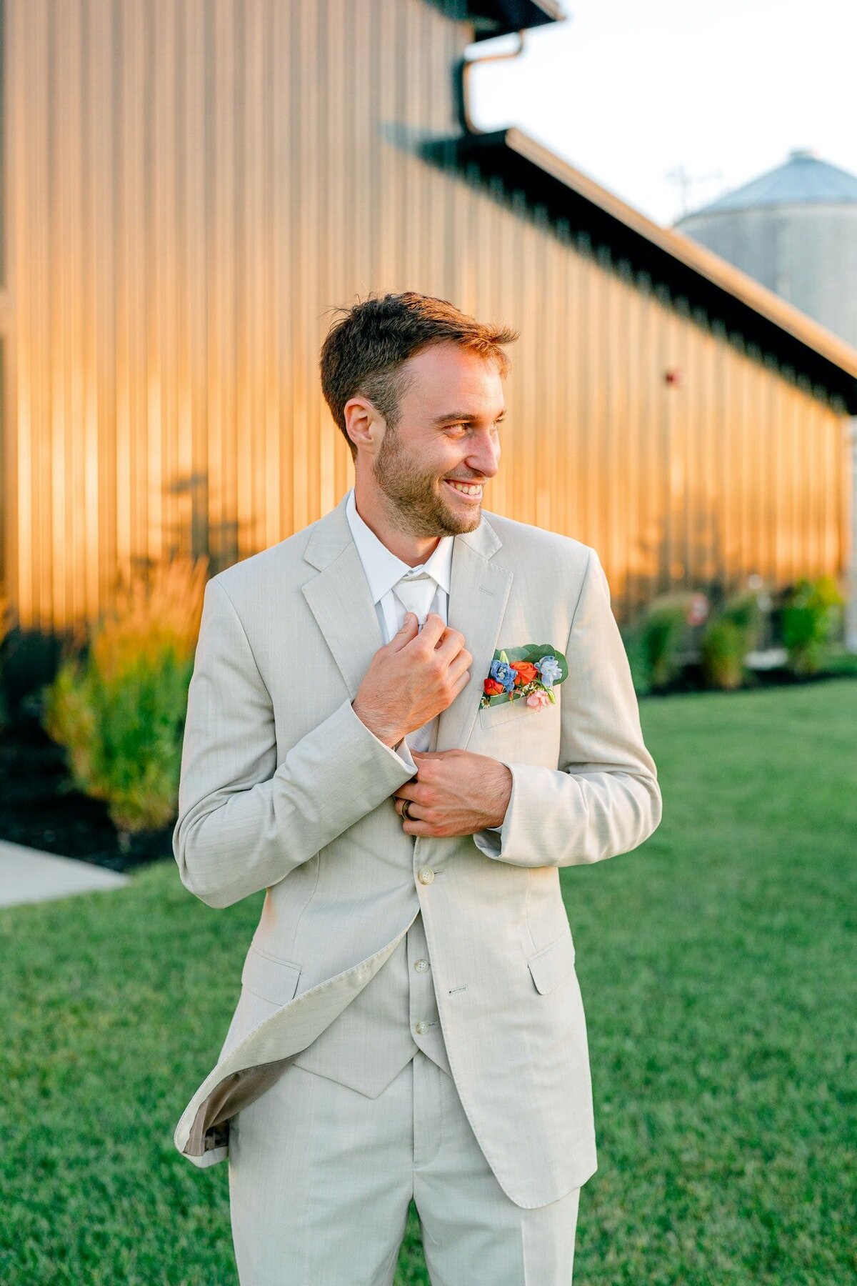 Groom-Smiling-Adjusting-Suit