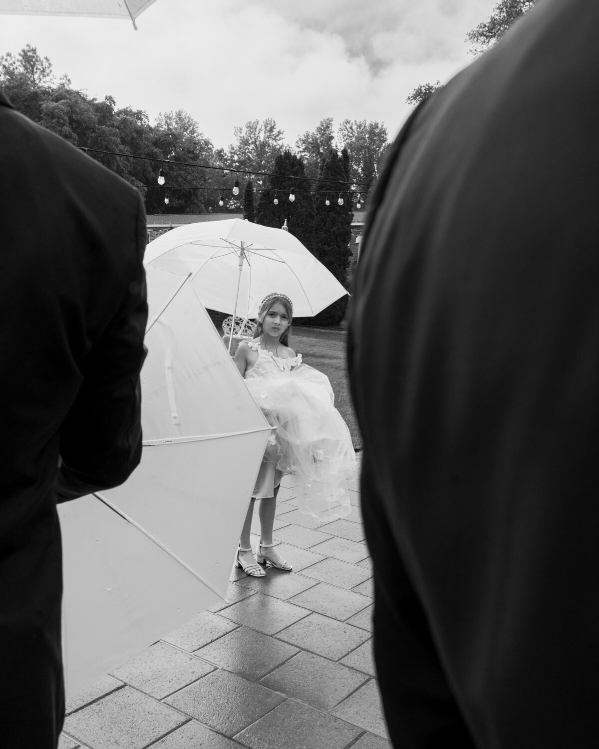 wedding flower girl with an umbrella