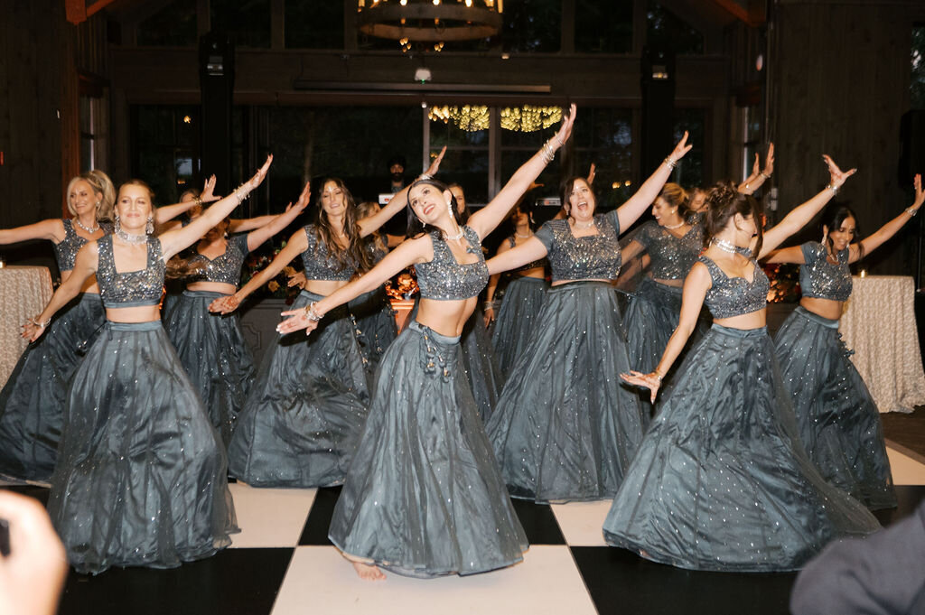 Bridesmaids perform choreographed dance at wedding reception in Highlands, NC.