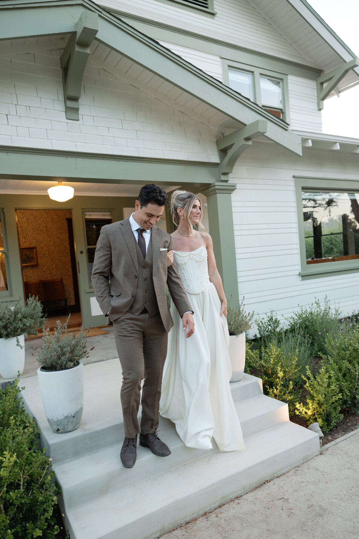 Bride and groom entering their reception, radiating joy and excitement, beautifully captured by a La Jolla wedding photographer.