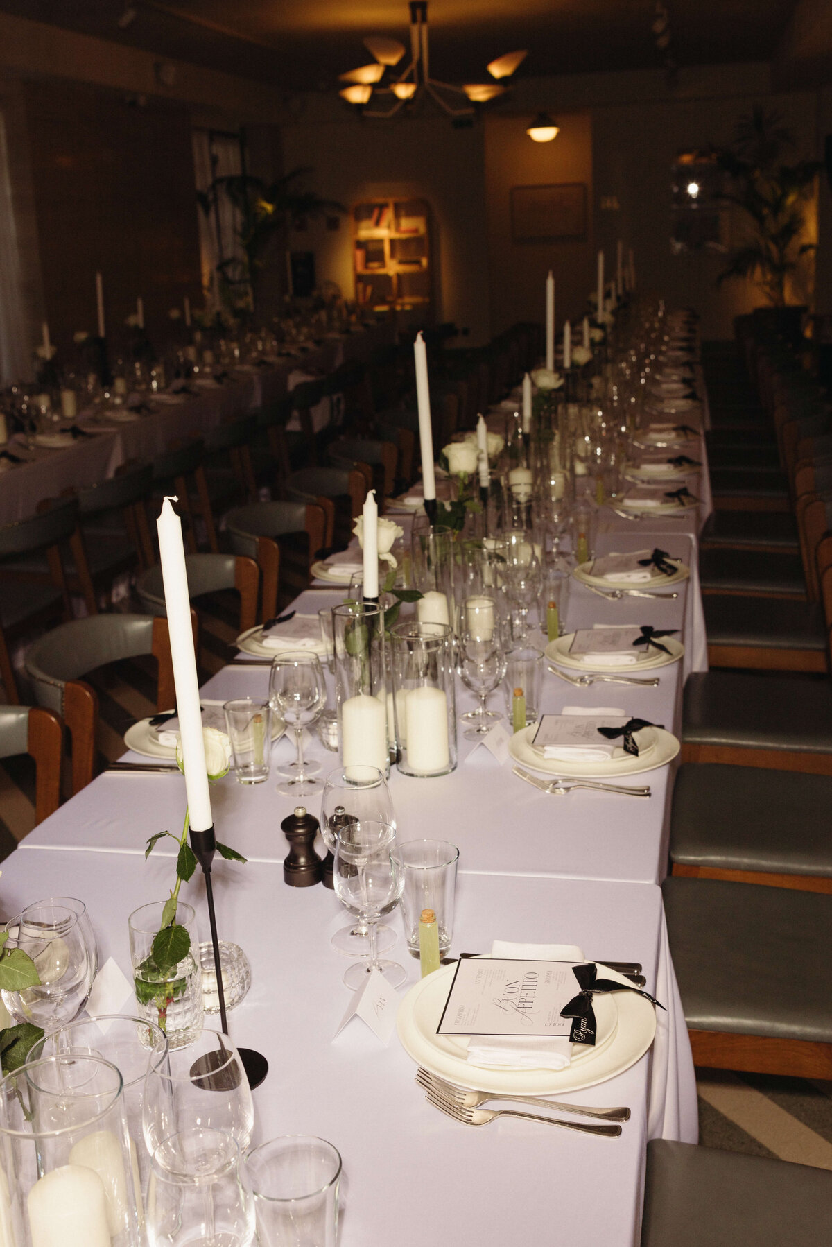 Long view of candlelit reception dinner table at Soho House Rome

