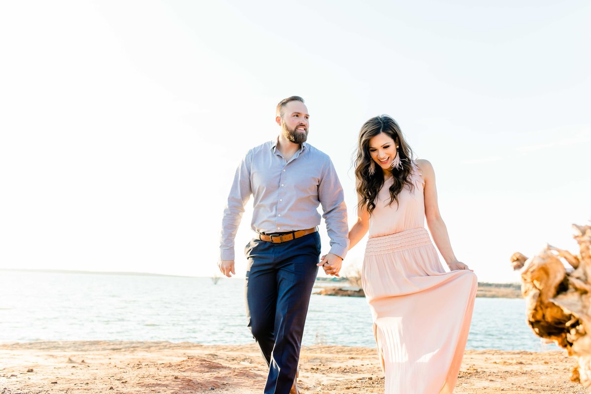 Engaged Couple Walking on Beach at Sunset. Murrell Park Egagment Pictures