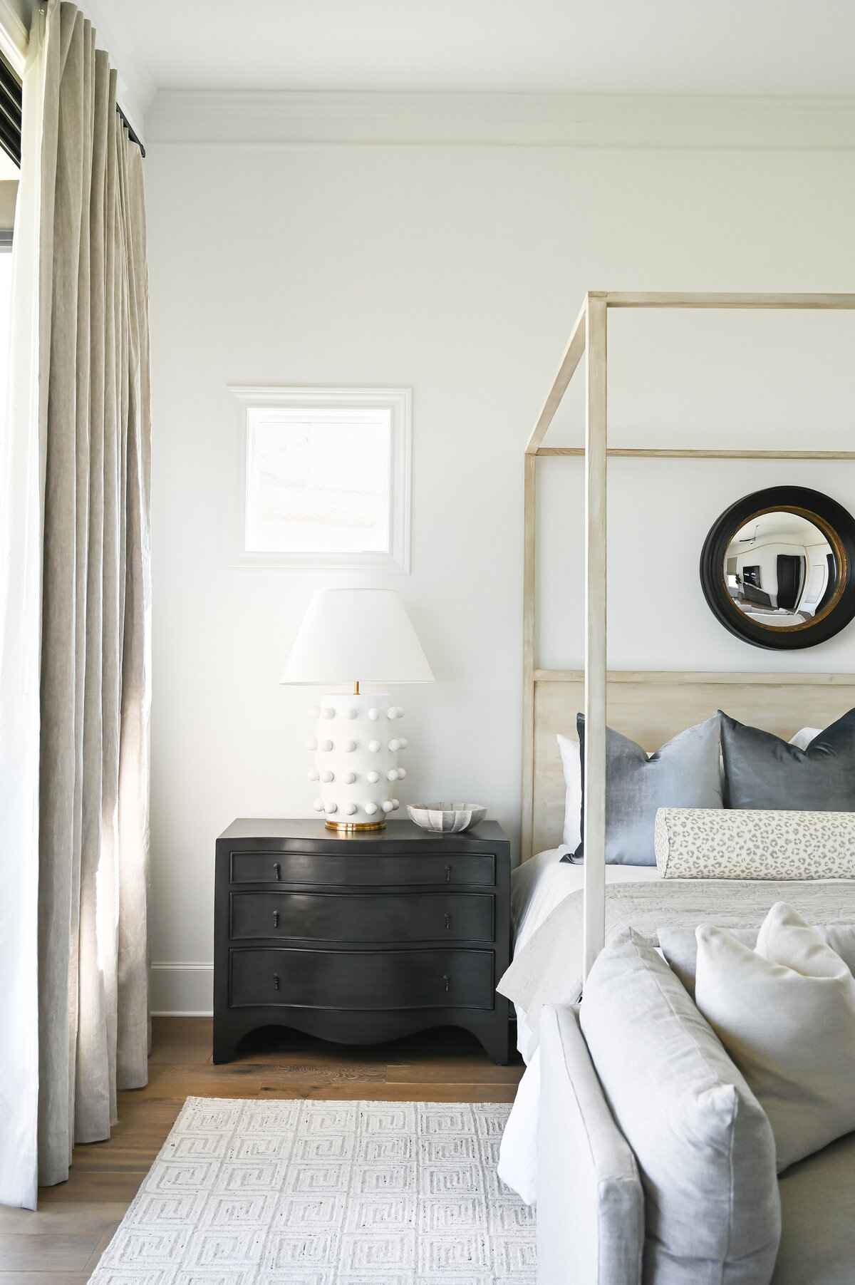 neutral bedroom with black end table