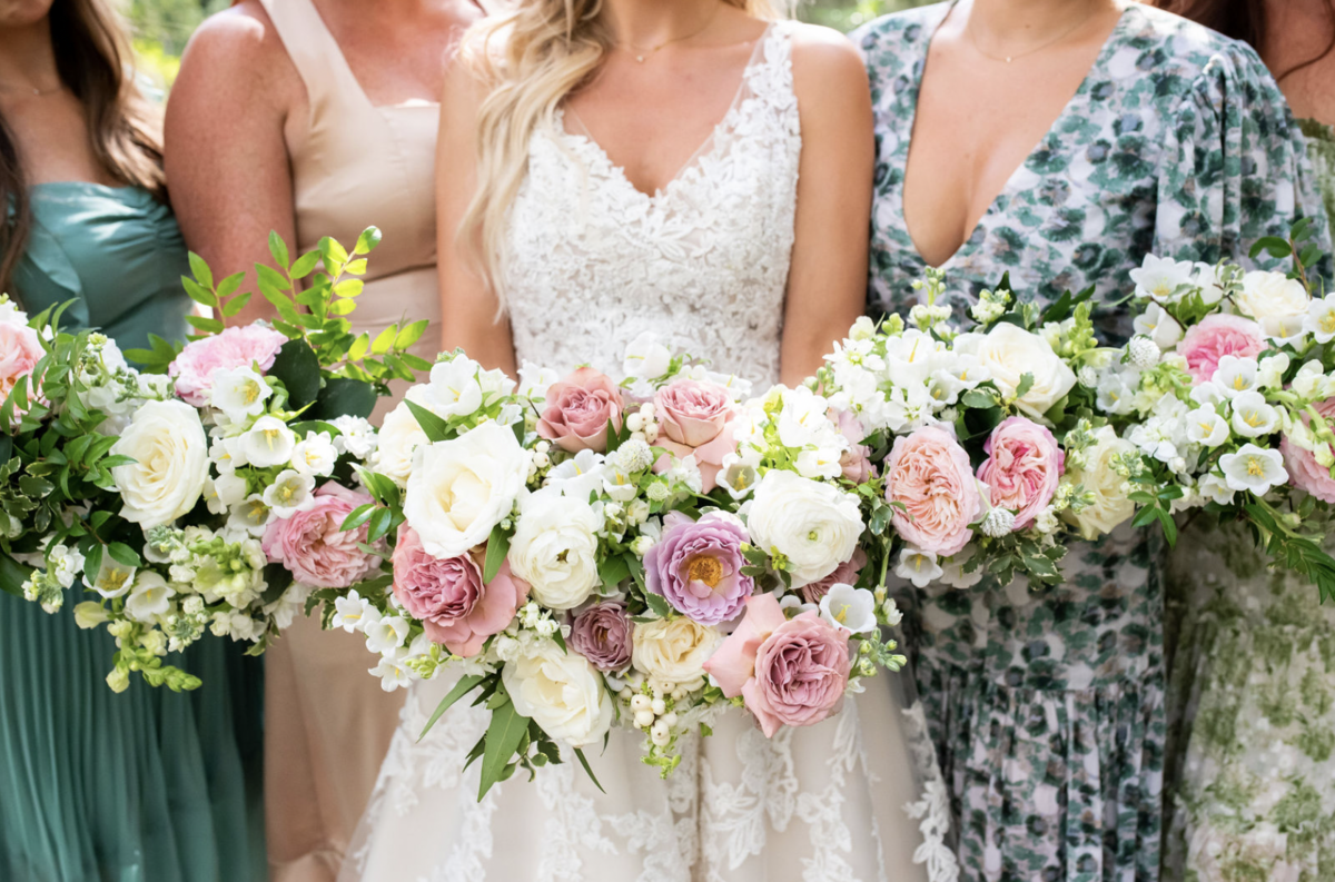 bride smiling with bridal party