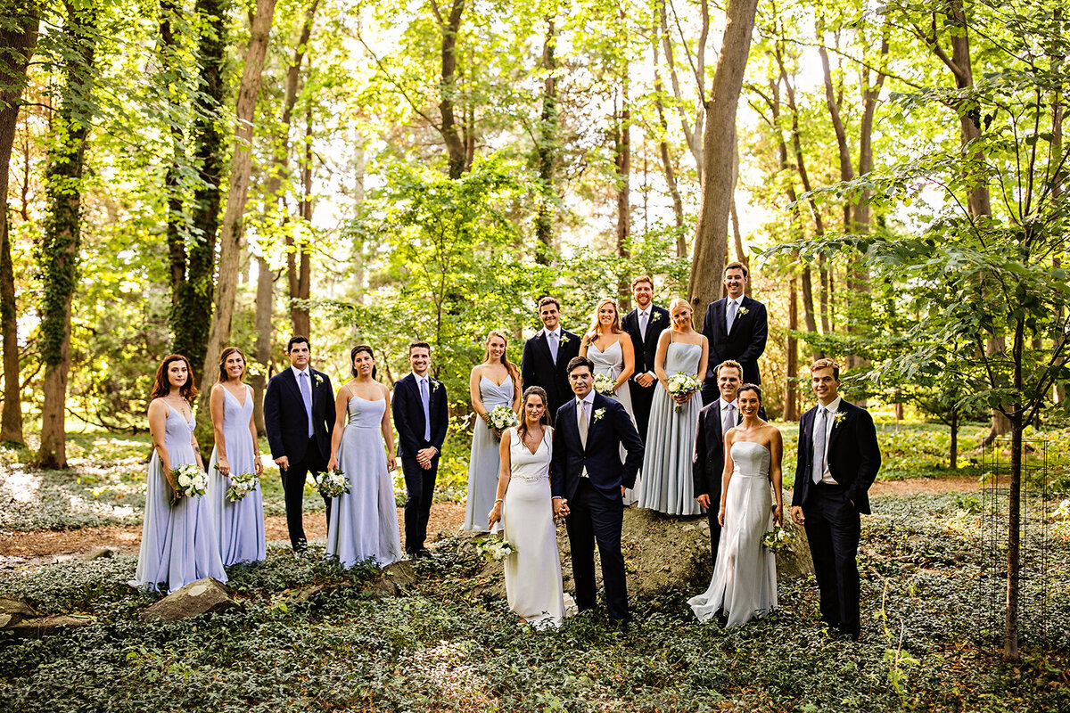Wedding party poses in the gardens at Blithewold Mansion