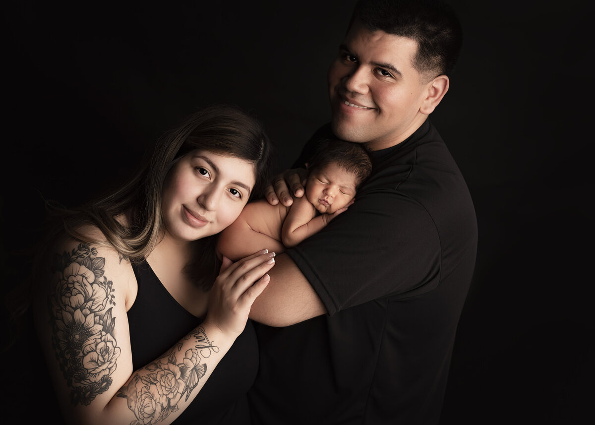 Black on black newborn family photo shoot in Syracuse New York