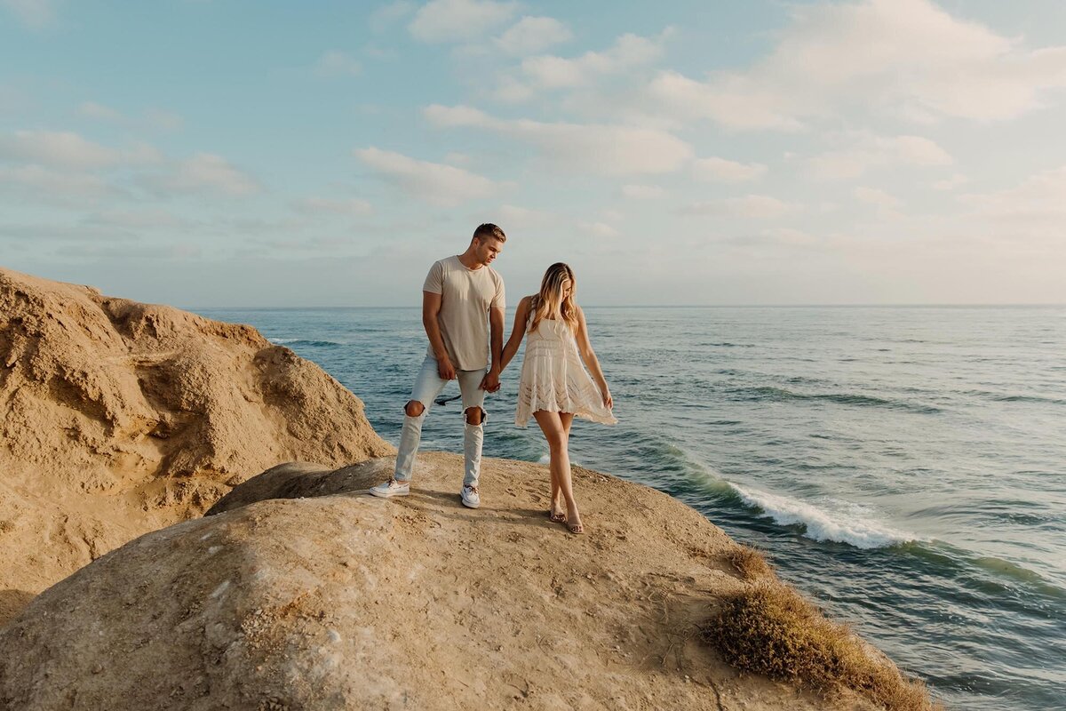 engaged-couple-on-cliff