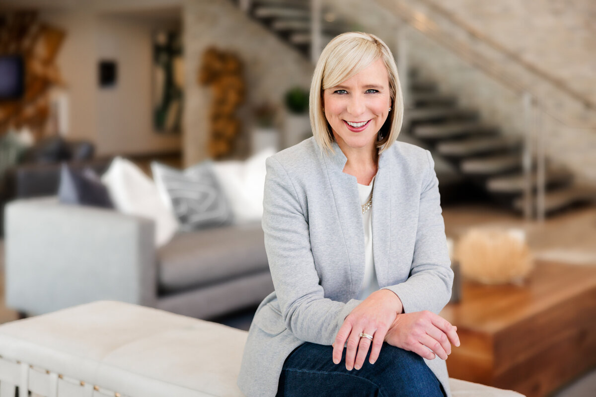 Woman poses with a smile for JM Visual Art Co for a headshot portrait