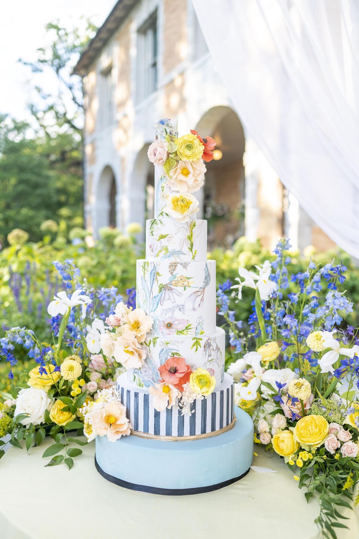 Wedding cake with yellow and orange flowers